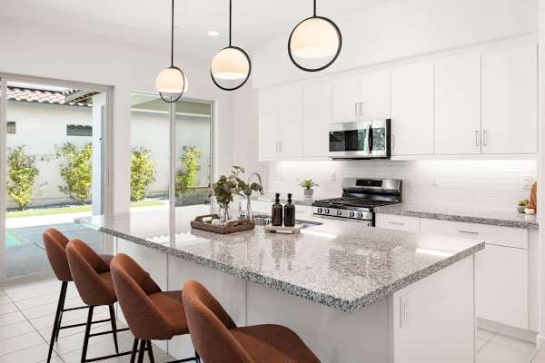 Kitchen island makes it easy to chat while cooking meals together.