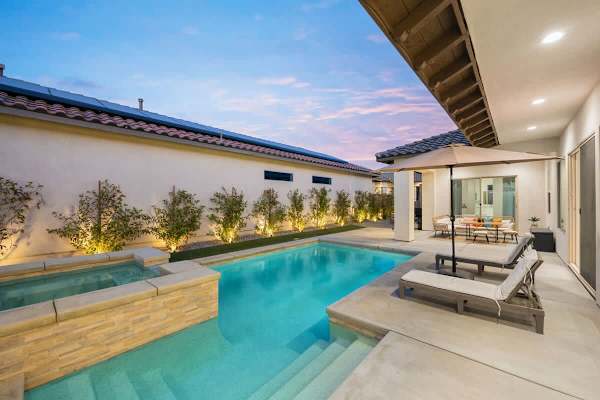 Sunset colors reflect off your private pool while the desert sky puts on a show.
