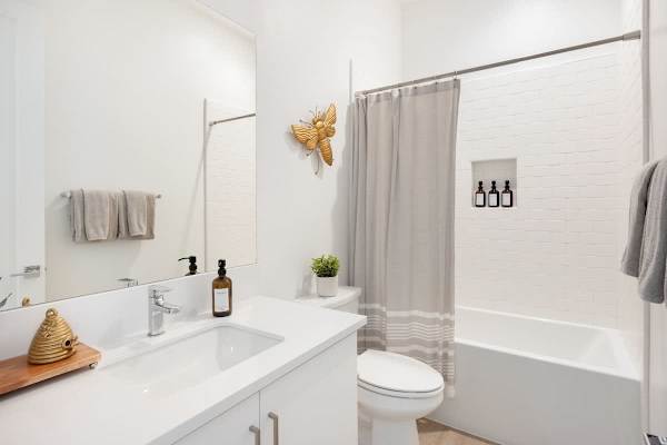 Full bathroom with tub serves the bunk room and secondary bedrooms.