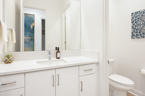 Half bathroom near the main living area with modern fixtures.