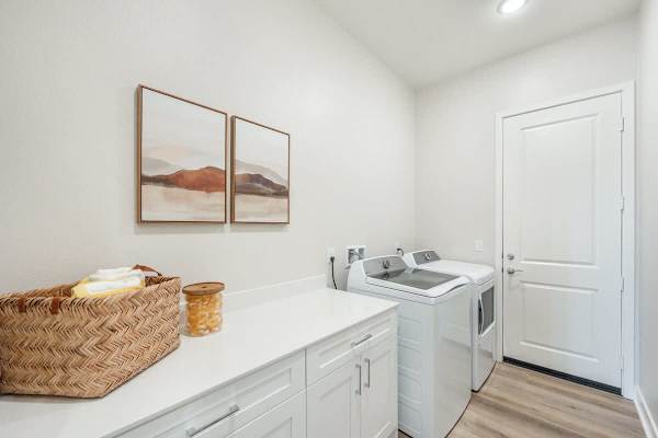 Full laundry room with washer, dryer, and ironing station so you can pack light and stay longer.