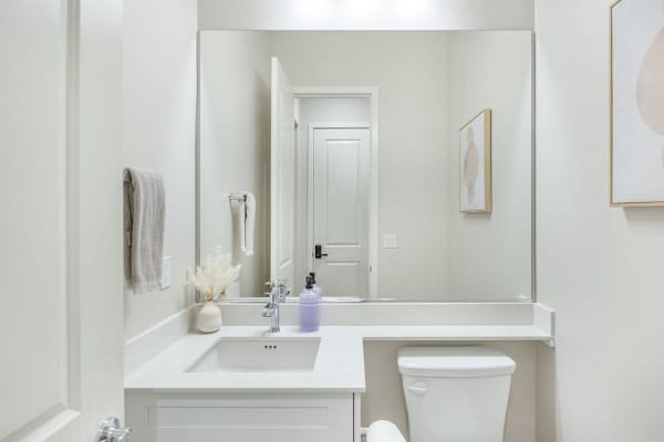 Convenient powder room near the main living area makes hosting and gathering much easier for everyone.