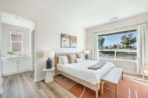 The primary suite offers serene golf course views.