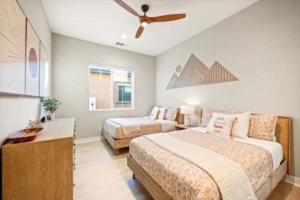 Spacious Bedroom 3 with 2 double beds for a restful stay.