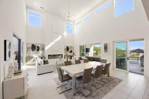 A dining table big enough for the whole crew with views straight through to the pool.