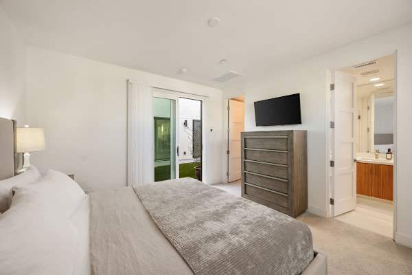The casita bedroom offers extra privacy with direct access to the pool and patio.