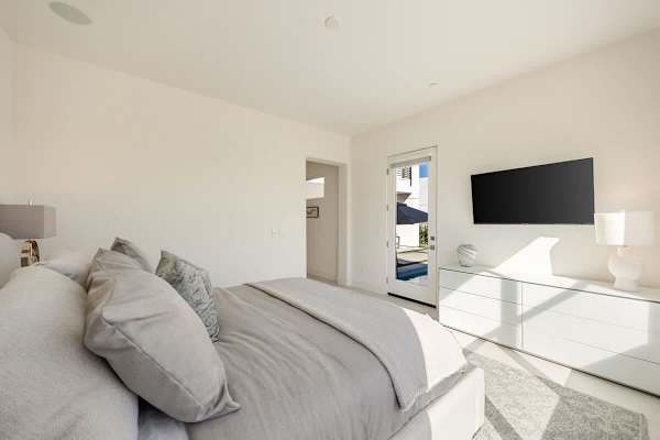 Your primary suite is a calm retreat with a TV and those mountain views right outside.