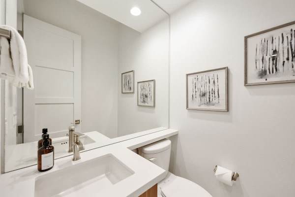 A convenient half bath for guests near the main living areas of the home.