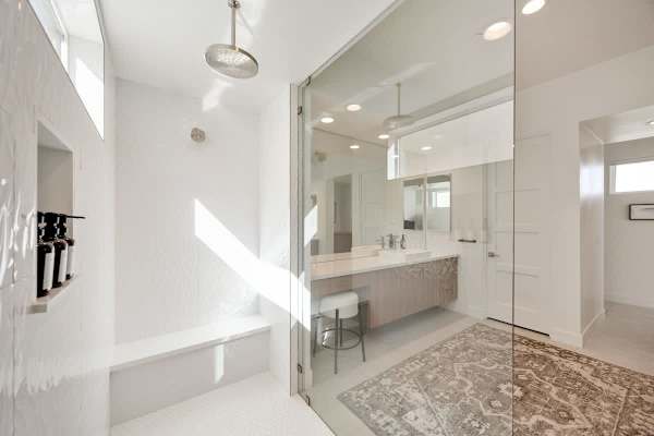 Step into your large walk-in shower with rainfall head and plenty of natural light.
