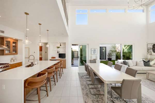 Plenty of seating at this massive dining table with natural light pouring in all day.