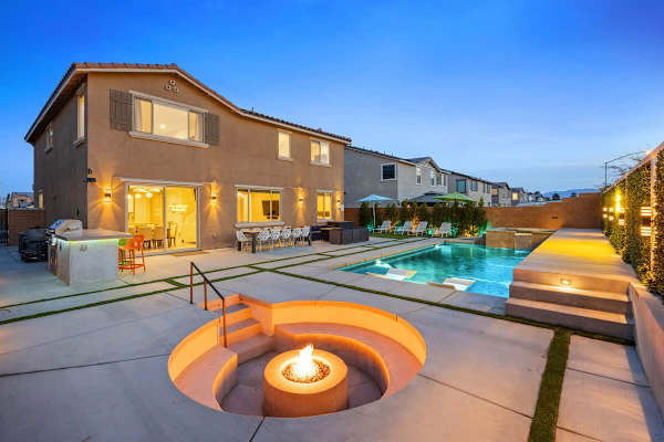 Entire backyard lit up at dusk—create your own resort.