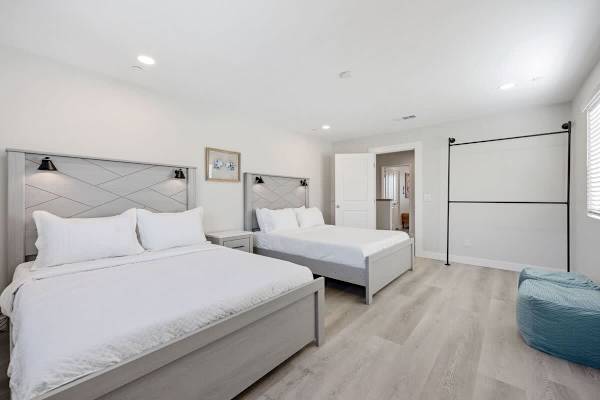 Bedroom features a hanging rod for your belongings.