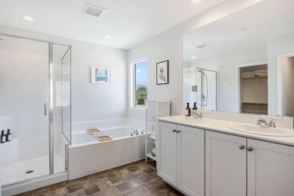 Dual vanities and walk-in shower—morning routines feel luxurious.