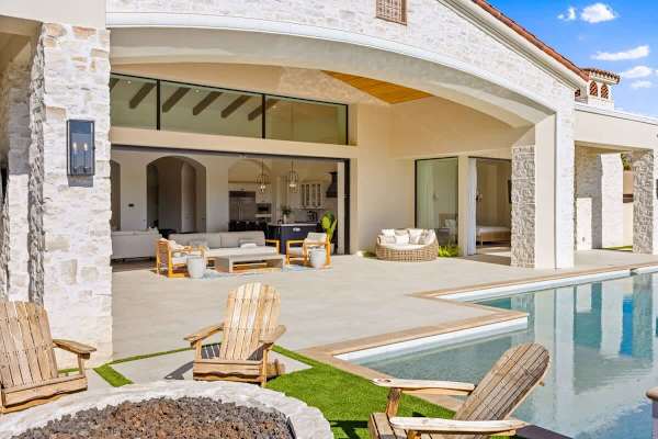 Stretch out on the artificial turf beside the pool with a cold drink in hand.