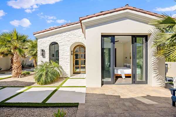 Private casita entrance with its own pathway and desert landscaping.