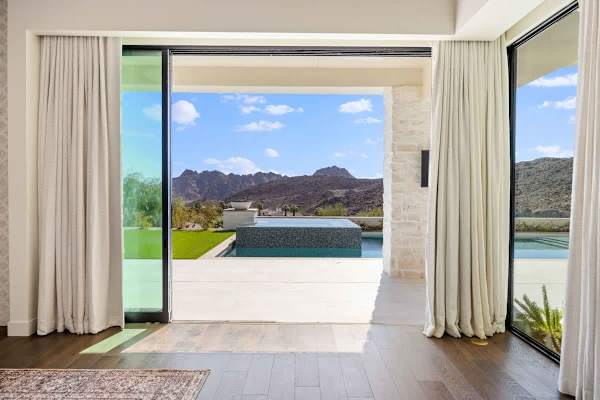 Step from your primary suite straight onto the patio and pool deck.
