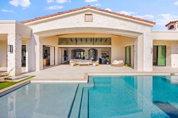 Step through the grand archway to your private pool and mountain panorama.