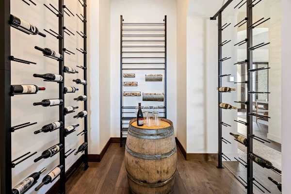 Temperature-controlled wine cellar stores your collection behind glass doors.