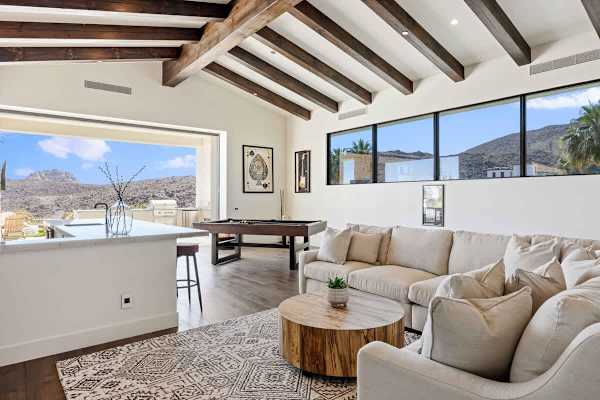 Vaulted ceilings and wraparound windows frame incredible desert mountain views.
