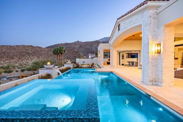 Watch the sky turn pink over the mountains as your infinity pool glows at dusk.