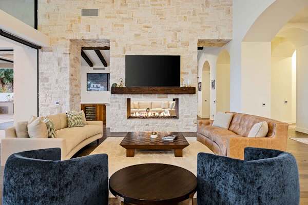 The great room offers a fireplace where the whole family can gather for a nice evening in.