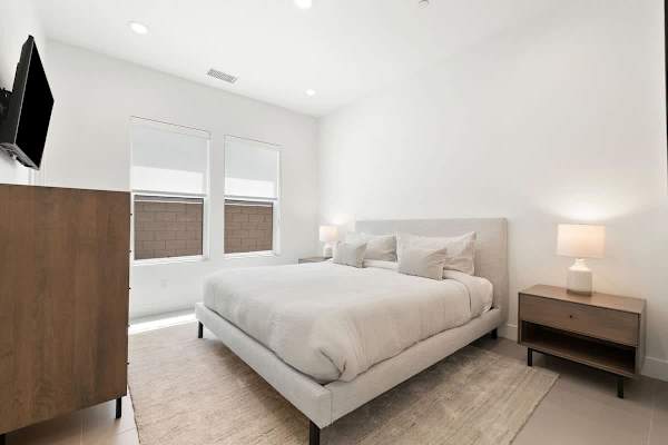 Comfortable Suite 2 with a cozy bed and modern amenities.