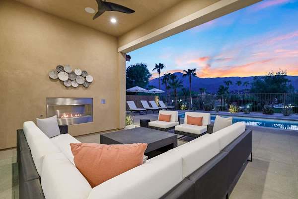 Spacious backyard with cover, ideal for dining or lounging outdoors.