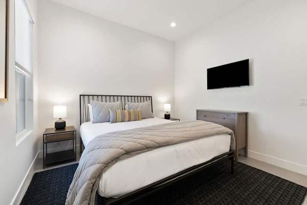 Spacious Suite #3 with a welcoming atmosphere and TV.