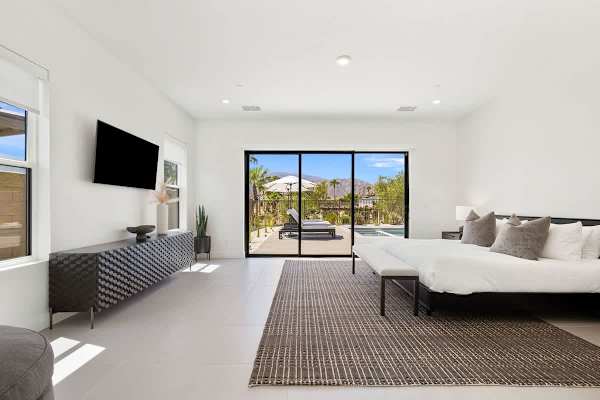 Master suite featuring a TV for unwinding after a long day.