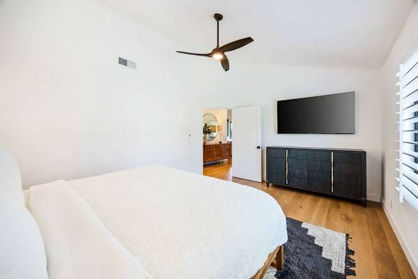 Third bedroom offers entertainment and relaxation space for all.