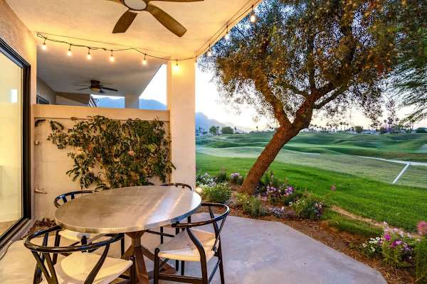 The covered patio features a fan sure to keep you cool and seats four.