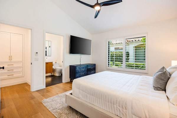 Suite 2 with wall-mounted TV —everyone gets their own entertainment space.