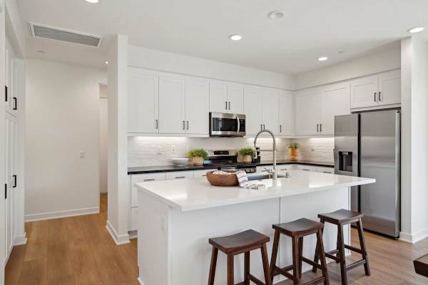 Kitchen island with bar seating lets guests chat with the cook while meals come together in this well-equipped space.