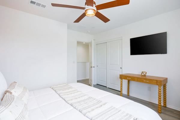Bedroom with queen bed, offers a simple and comfortable retreat for extra guests.
