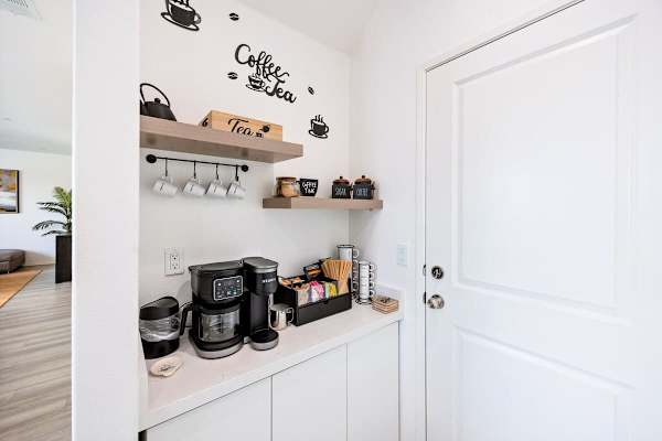 The coffee station is conveniently located in the kitchen. Start your mornings hassle-free!