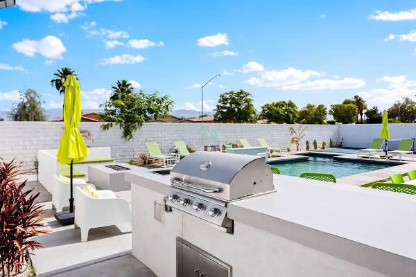 Built-in BBQ and covered patio by the pool means you can grill, dine, and swim.