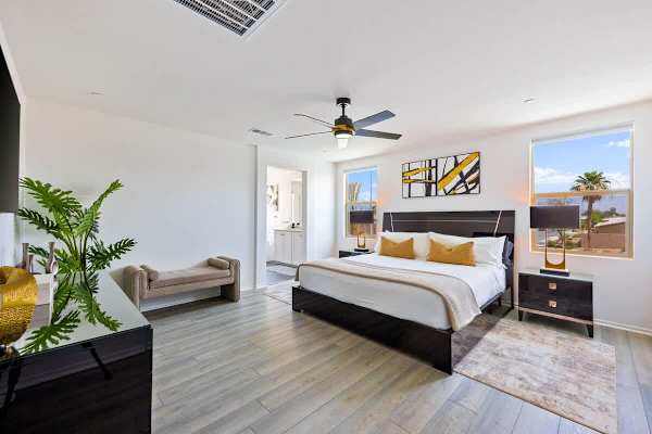 Primary bedroom with king bed, and mountain views provides a serene retreat.