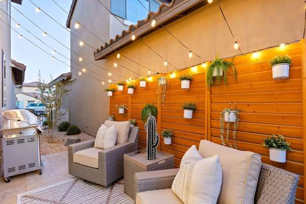 The side patio has string lights overhead..