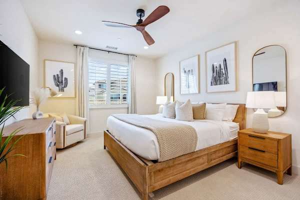 The primary bedroom with plenty of natural light streaming in.