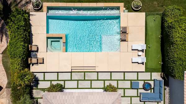Your private desert escape with a sparkling pool and mountain backdrop awaits.