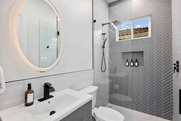 Stylish bathroom with designer tile and a spacious glass shower.