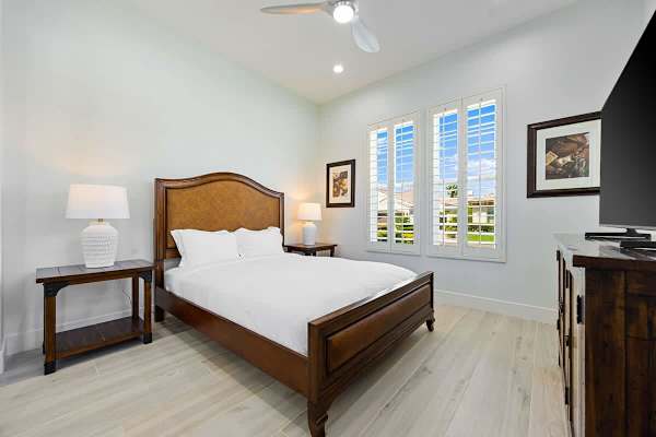 Third bedroom featuring warm wood tones and plenty of natural light.