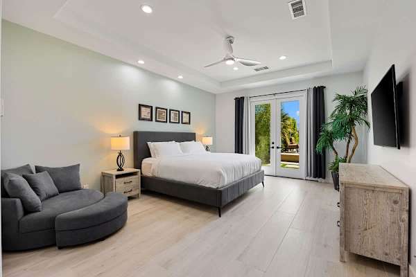 Wake up to golf course views in this bright, peaceful primary suite.