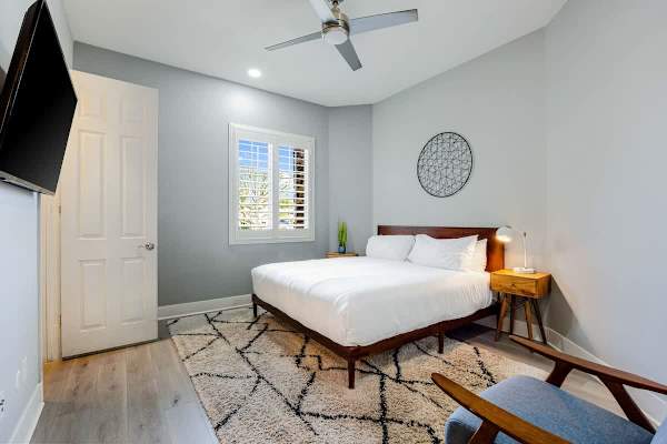 Wake refreshed in this bright bedroom with quality linens.