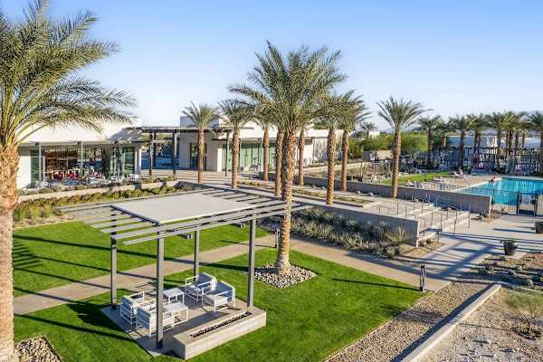 outdoor seating areas with green spaces and pool views