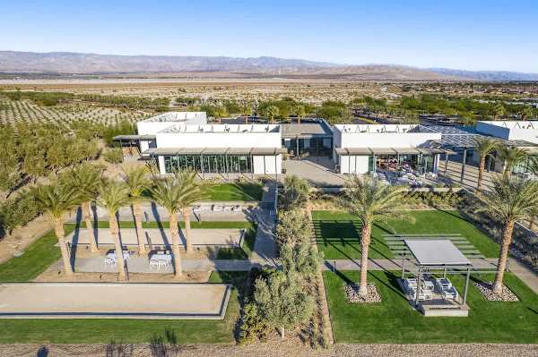 Aerial view of the clubhouse surrounded by palm trees