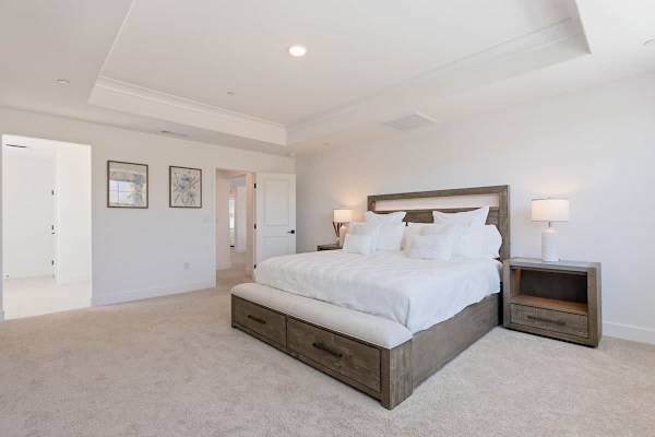 Master Suite features a 75 inch TV, his and hers walk-in closets, and ensuite bathroom.