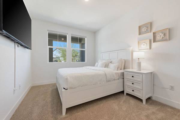 Bedroom 4 (By front door) features a 75 inch smart TV, reach-in coset (downstairs).