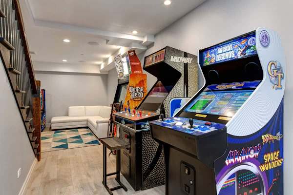 Media Room | Lower Level, TV, Shuffleboard, Arcade Legends, Guitar Hero, Whac-a-Mole & More! | Abode at First Chair