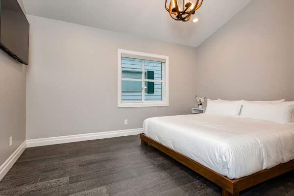 Bedroom 1 | Main Level, King Bed, Closet, TV, Full Ensuite Bathroom with Shower, His & Her's Sinks  | Abode at First Chair
